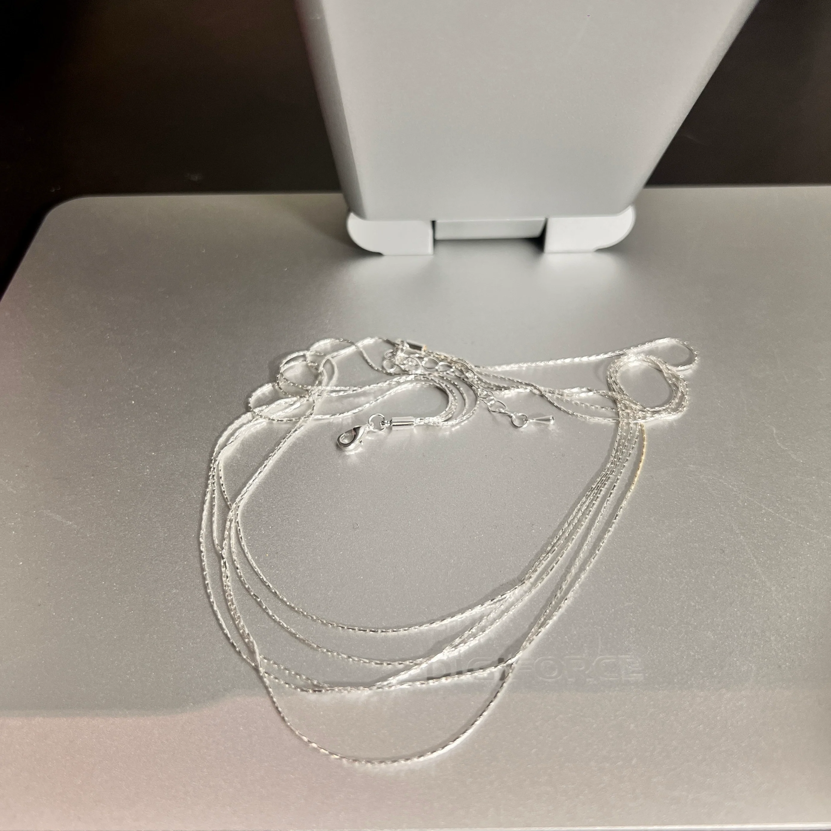 Sanhoostudio’s silver multi-layer thin chain necklace delivers delicate sparkle and romantic bling—perfect for layering, special occasions, and elevating everyday outfits with refined shine.