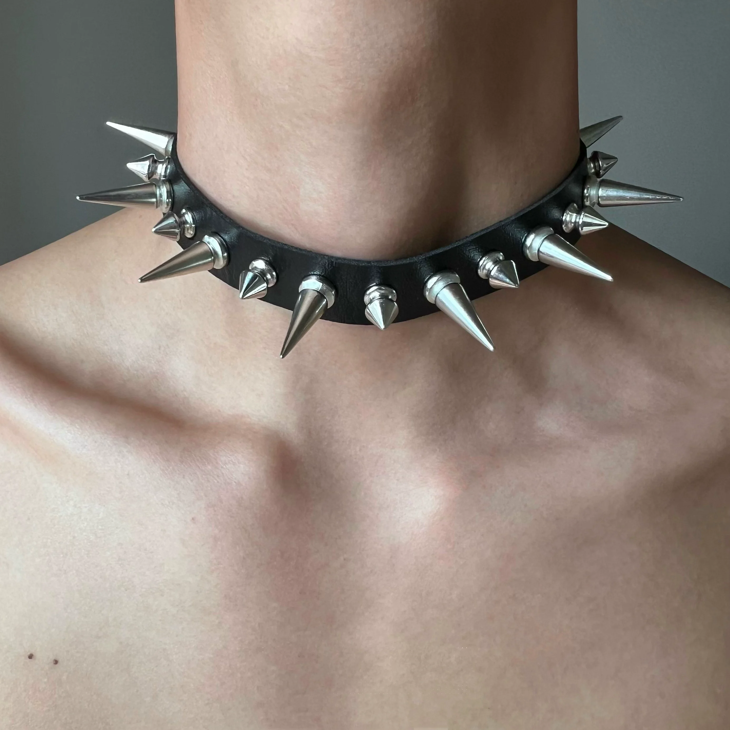 Discover Sanhoostudio’s rock studded punk leather choker, blending Y2K subculture aesthetics with bold metal detailing for a rebellious, fashion-forward accessory that elevates streetwear outfits.