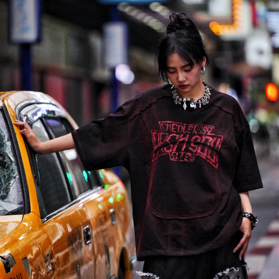 Sanhoostudio oversized short sleeve T-shirt featuring graphic print design and relaxed fit silhouette. Perfect for streetwear outfits with breathable fabric, lightweight feel, and daily casual styling.