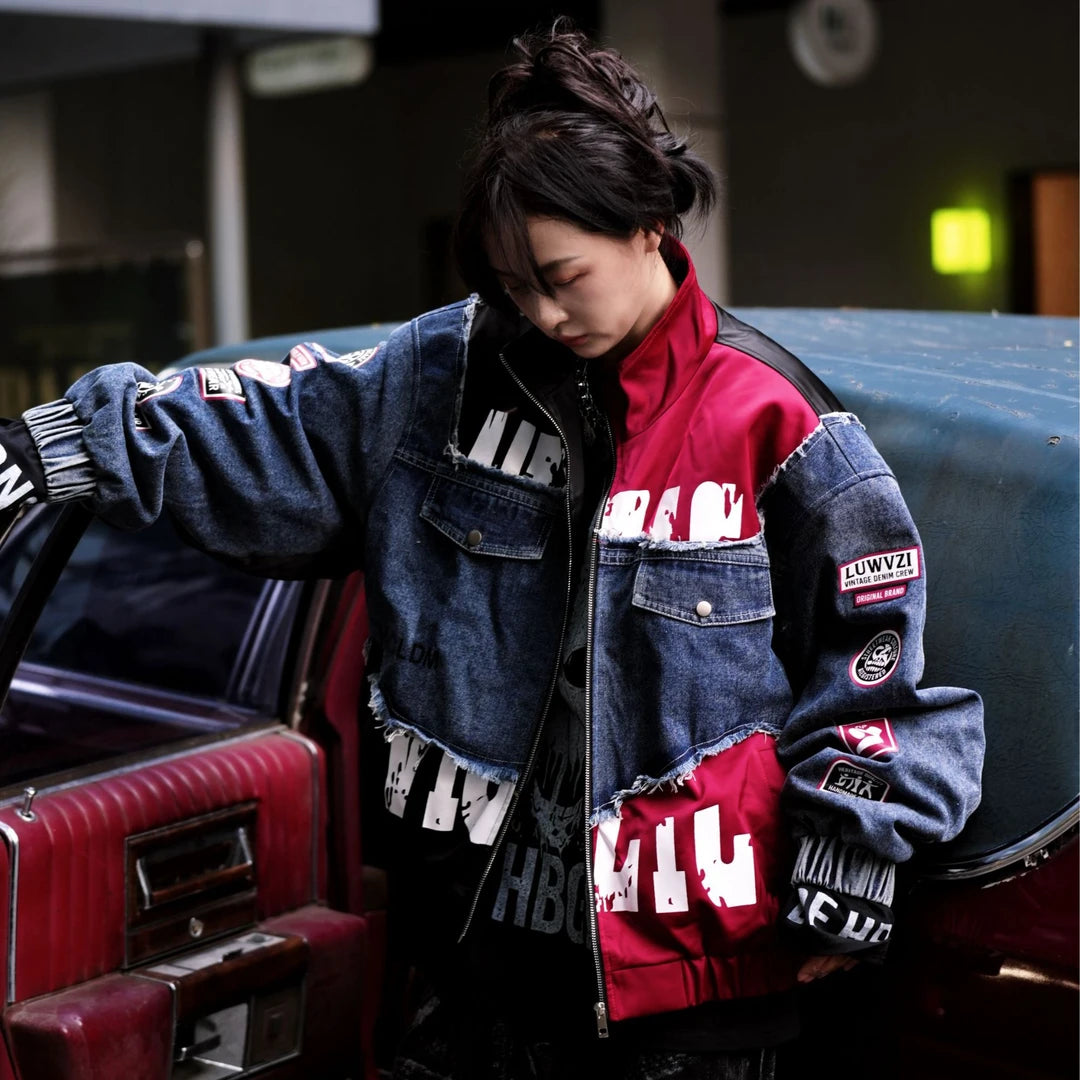 Sanhoostudio denim jacket featuring black patch applique embroidery, distressed surface detailing, and a relaxed oversized silhouette with added seasonal warmth. Designed for statement streetwear layering with rugged texture, handcrafted character, and versatile urban styling.