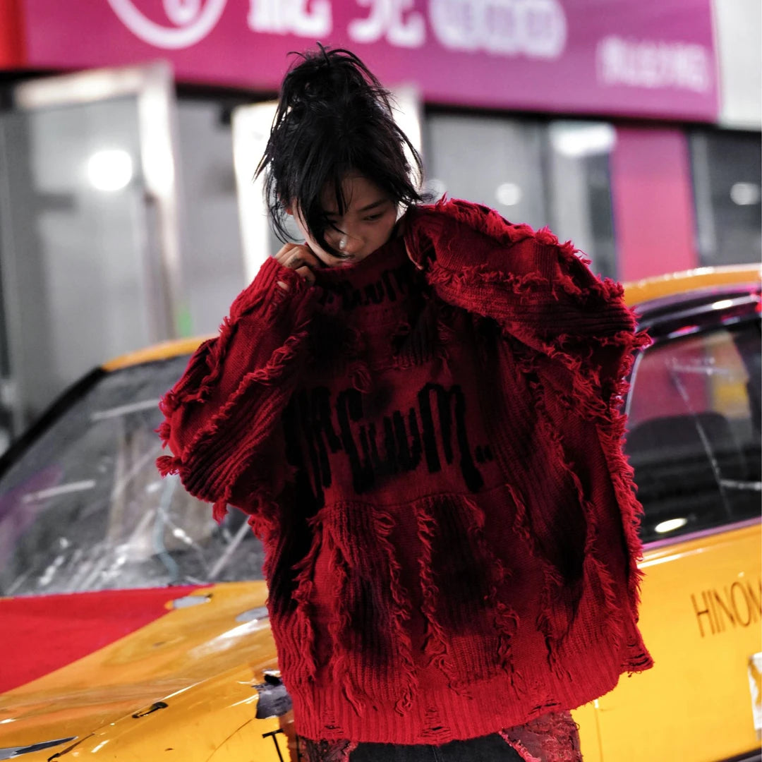 Street rebellion meets knit precision — this high-density graffiti sweater with distressed neck and paint-splash detail reflects SanhooStudio’s high-street chaos and raw design soul.