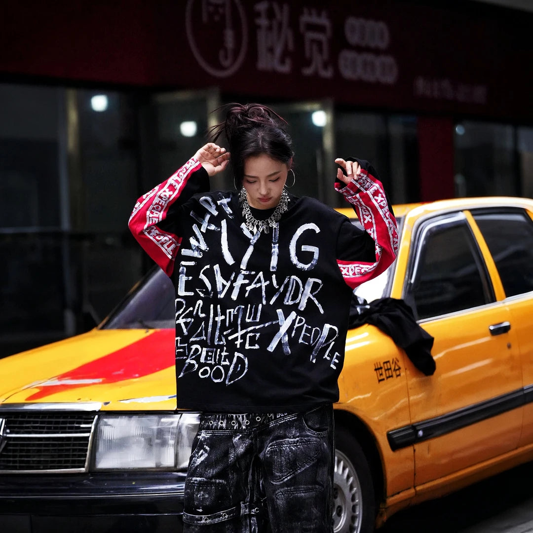 Sanhoostudio short sleeve T-shirt featuring hand-painted graphic artwork, contrast patchwork detailing, and a relaxed oversized silhouette. Designed for expressive streetwear styling with breathable everyday comfort, bold visual texture, and versatile urban appeal.
