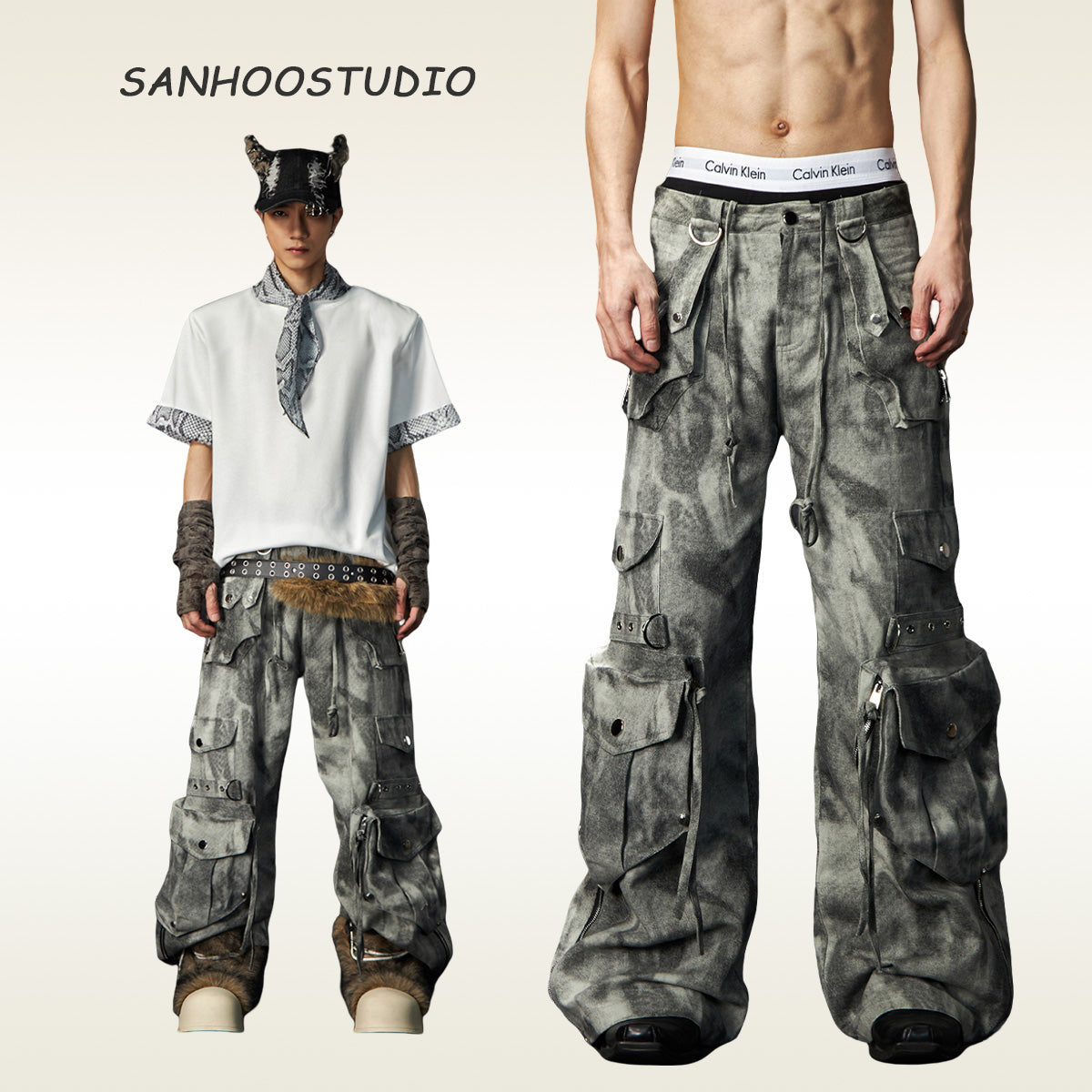 The Sanhoostudio distressed mud-dye cargo pants feature a heavy washed finish, rugged multi-pocket design, and a relaxed straight-leg fit. Perfect for utilitarian and high street styling, they combine functionality with bold design, making them an essential statement for everyday streetwear wardrobes.