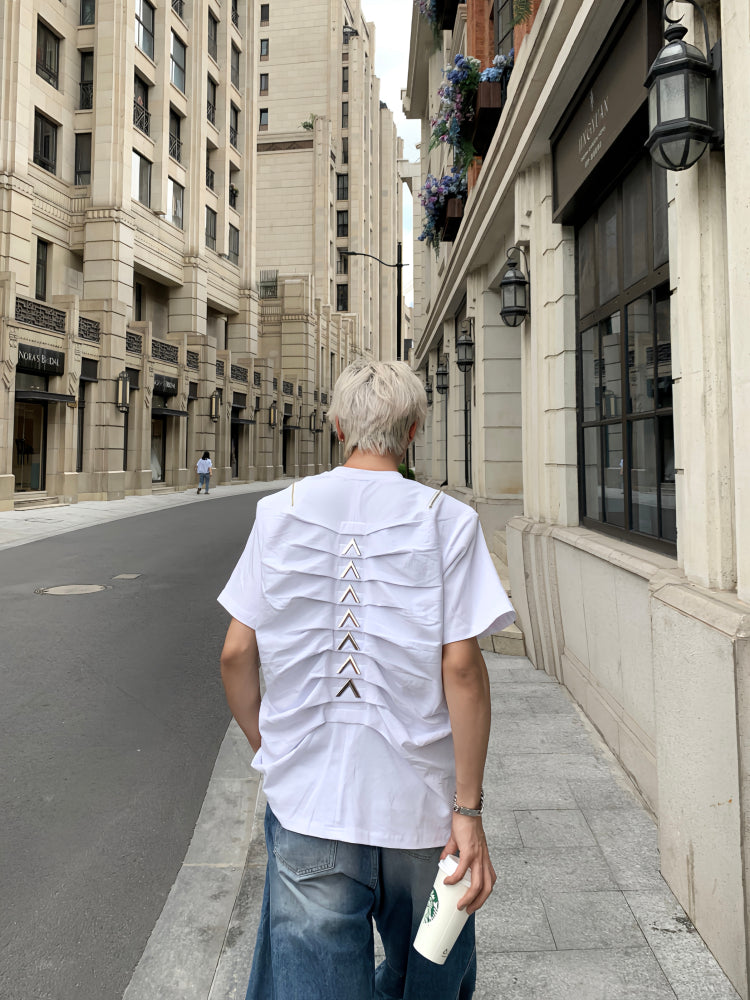Designed by Sanhoostudio, this T-shirt features spine-inspired metallic pleats paired with structured shoulder pads for a futuristic silhouette. Its innovative design and premium construction highlight an avant-garde streetwear vibe, balancing comfort with standout style for bold everyday looks.