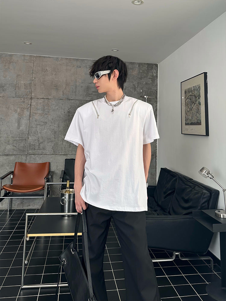 Designed by Sanhoostudio, this T-shirt features spine-inspired metallic pleats paired with structured shoulder pads for a futuristic silhouette. Its innovative design and premium construction highlight an avant-garde streetwear vibe, balancing comfort with standout style for bold everyday looks.