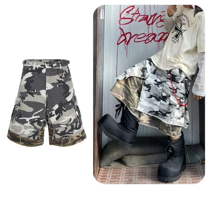 These Sanhoostudio camouflage shorts feature a layered fake two-piece design with a relaxed oversized silhouette and fringe detailing. Combining military ruggedness with deconstructed streetwear aesthetics, they stand out in everyday styling.