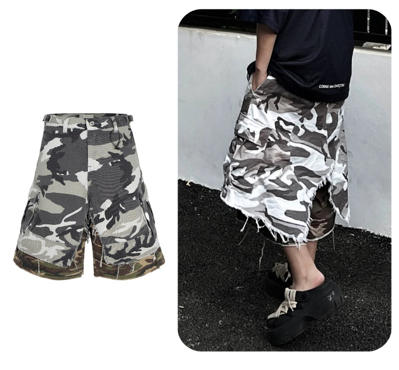 These Sanhoostudio camouflage shorts feature a layered fake two-piece design with a relaxed oversized silhouette and fringe detailing. Combining military ruggedness with deconstructed streetwear aesthetics, they stand out in everyday styling.
