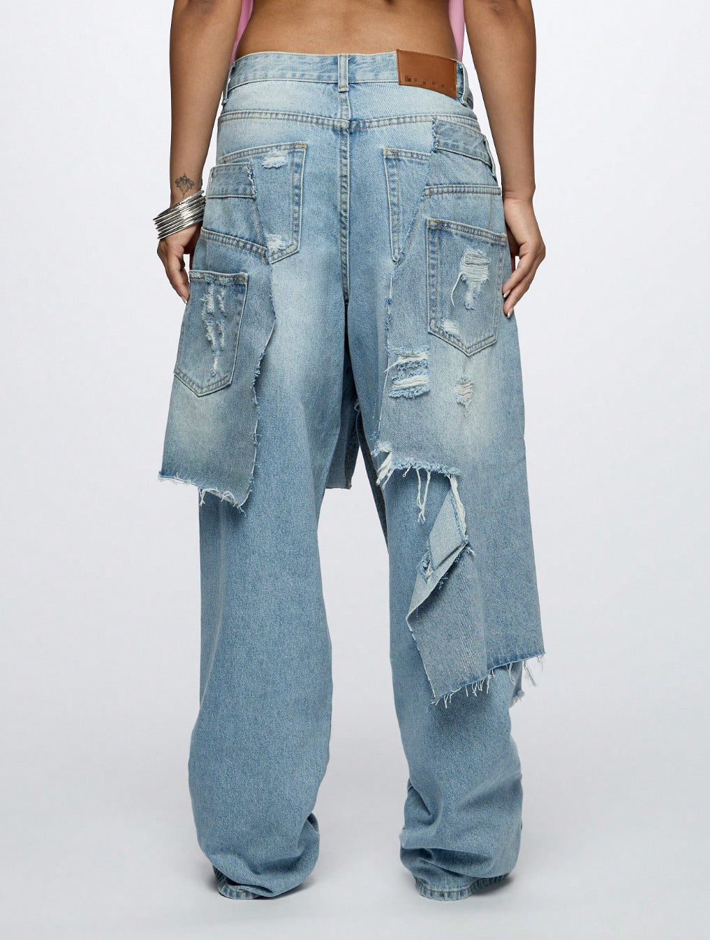 Upgrade your streetwear with the Loose Ripped High-Street Denim Jeans from Sanhoostudio. Designed with a relaxed fit and stylish distressed details, these jeans offer maximum comfort while keeping you effortlessly trendy. Perfect for casual outings and urban fashion looks.