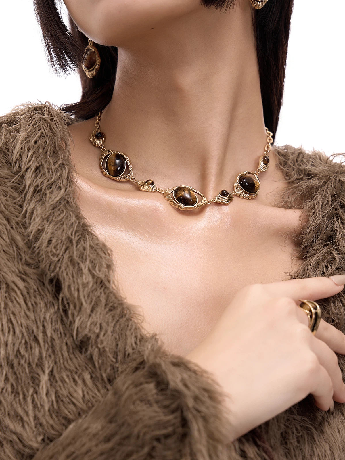 Sanhoostudio’s tiger eye statement necklace reflects bold luxury with vintage Maillard undertones. A striking accessory that defines modern elegance.