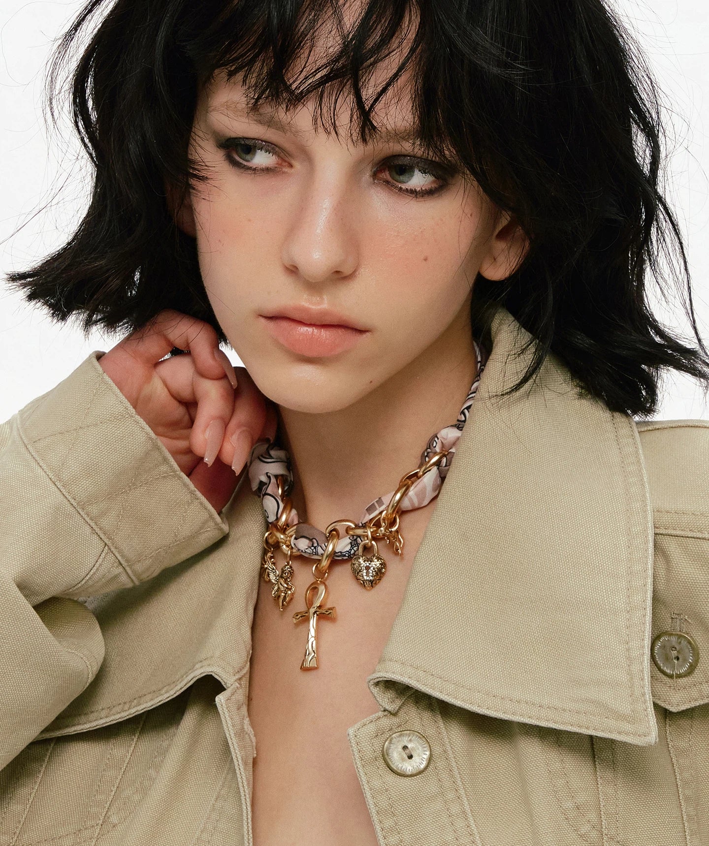 A bold blend of textures — Sanhoostudio’s silk scarf Ankh necklace brings soft femininity and edgy charm into one elegant design.