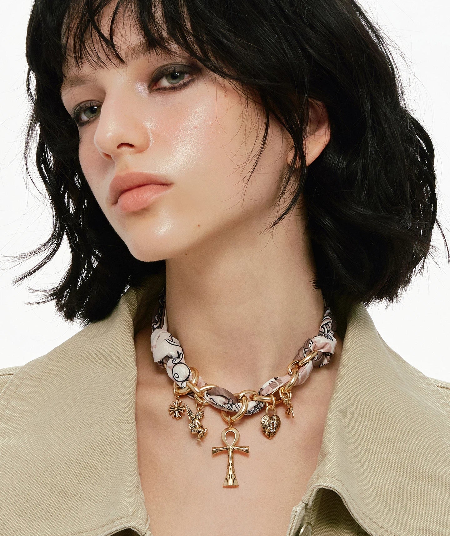 A bold blend of textures — Sanhoostudio’s silk scarf Ankh necklace brings soft femininity and edgy charm into one elegant design.