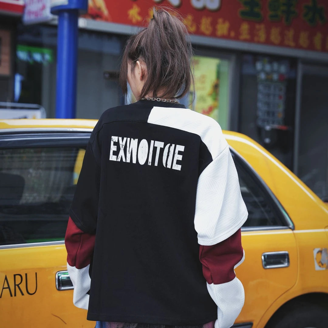 A vintage-inspired two-tone hoodie with a layered look and oversized silhouette. Comfortable, versatile, and perfect for daily streetwear.