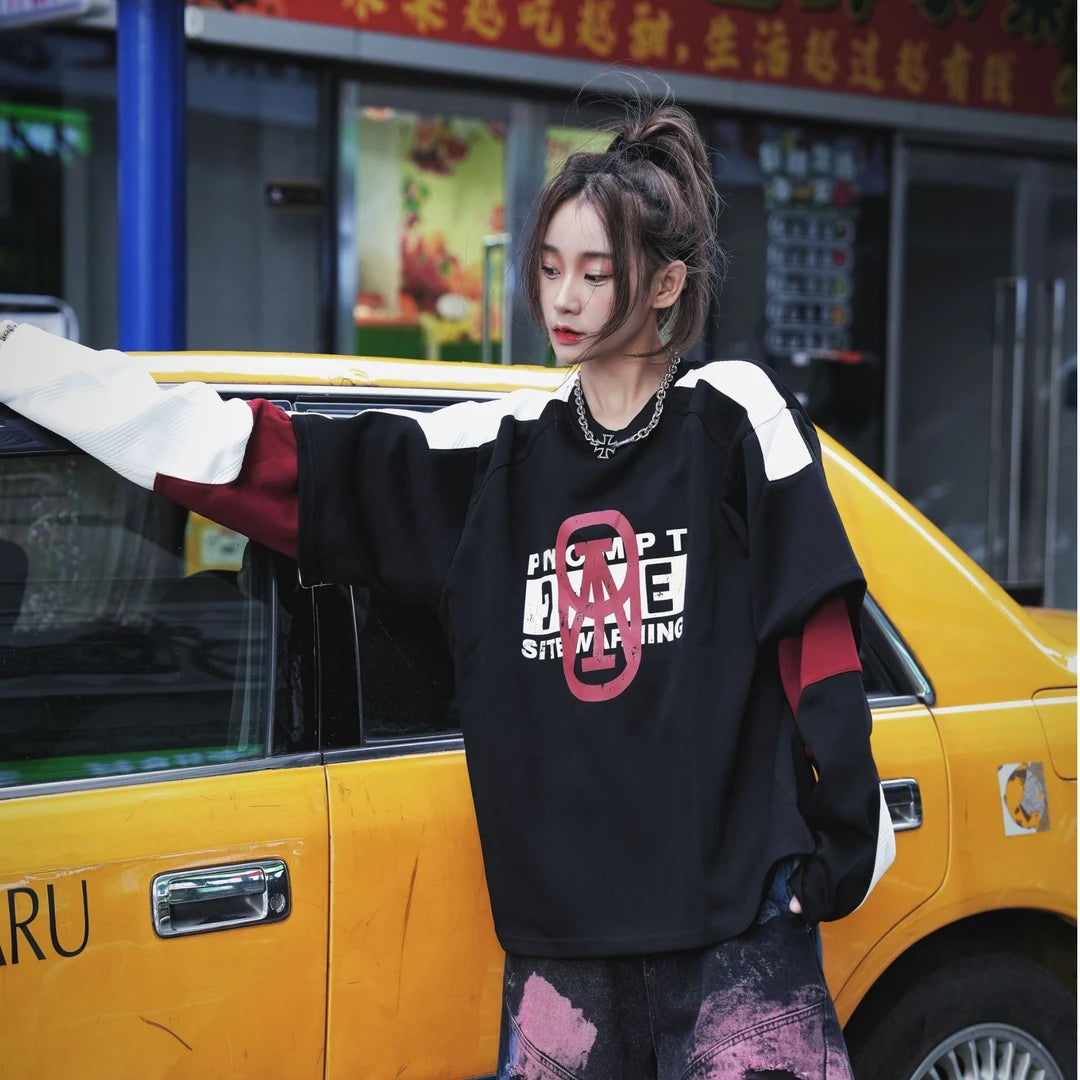 A vintage-inspired two-tone hoodie with a layered look and oversized silhouette. Comfortable, versatile, and perfect for daily streetwear.