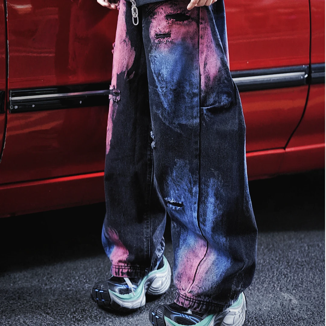 Blade-cut washed denim pants with a wide-leg fit for a relaxed streetwear silhouette. Stylish, comfortable, and perfect for daily outfits.