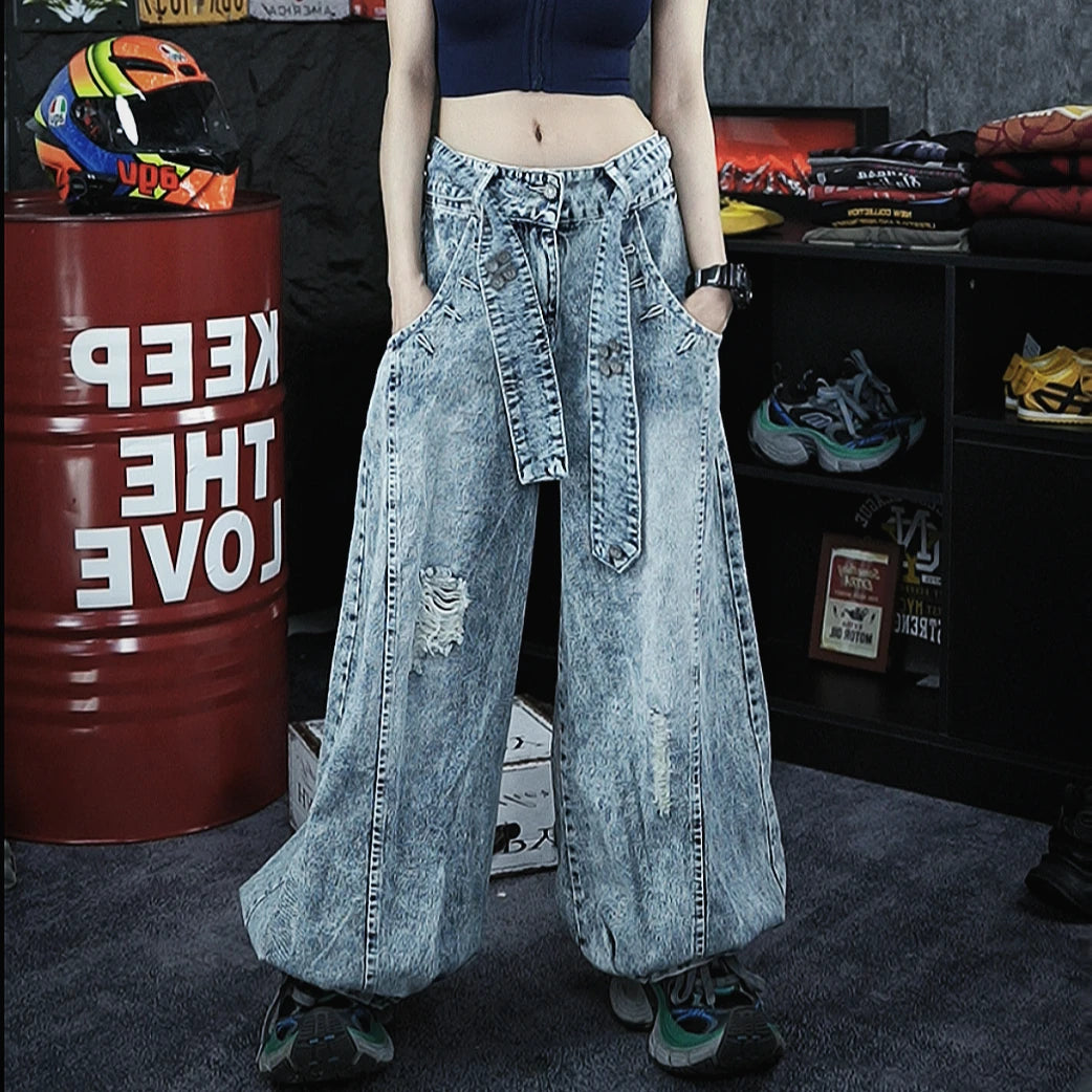 Retro-inspired wide-leg jeans featuring lantern-style drape and distressed cutouts. A unique American vintage streetwear statement.