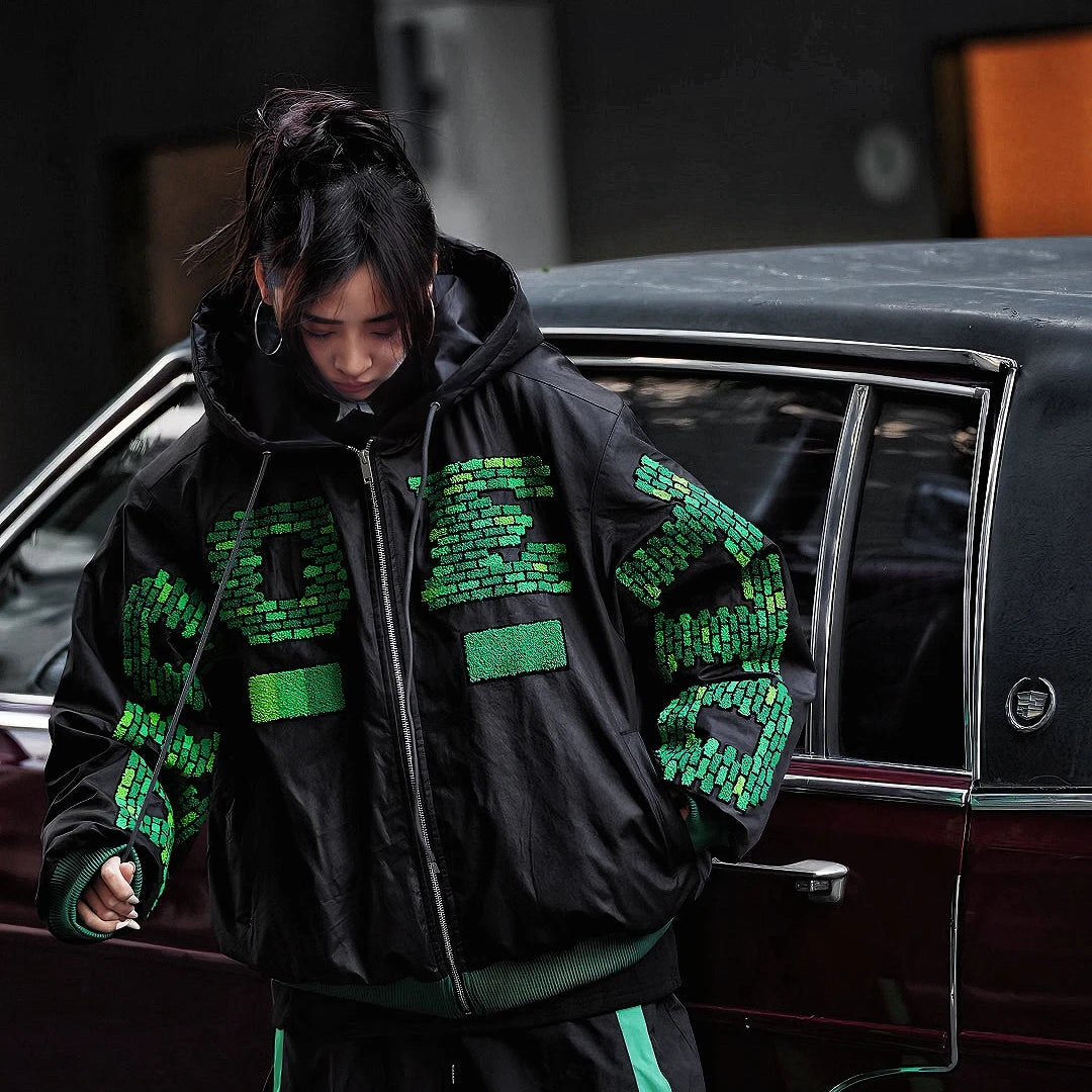 Sanhoostudio heavyweight hooded jacket features handcrafted patchwork details, a relaxed oversized fit, and a double-breasted front. Designed for winter warmth with bold street attitude.