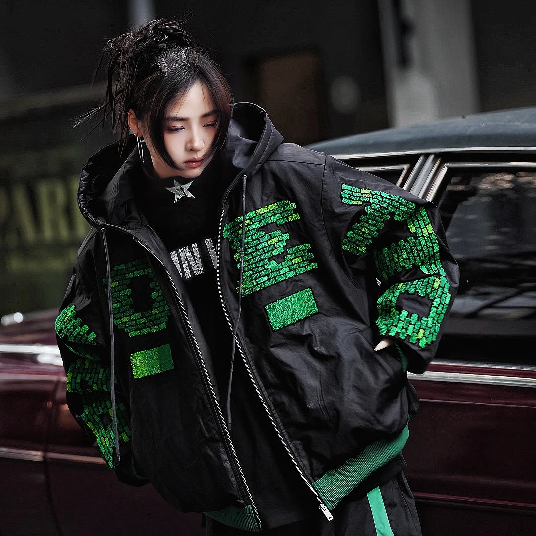 Sanhoostudio heavyweight hooded jacket features handcrafted patchwork details, a relaxed oversized fit, and a double-breasted front. Designed for winter warmth with bold street attitude.