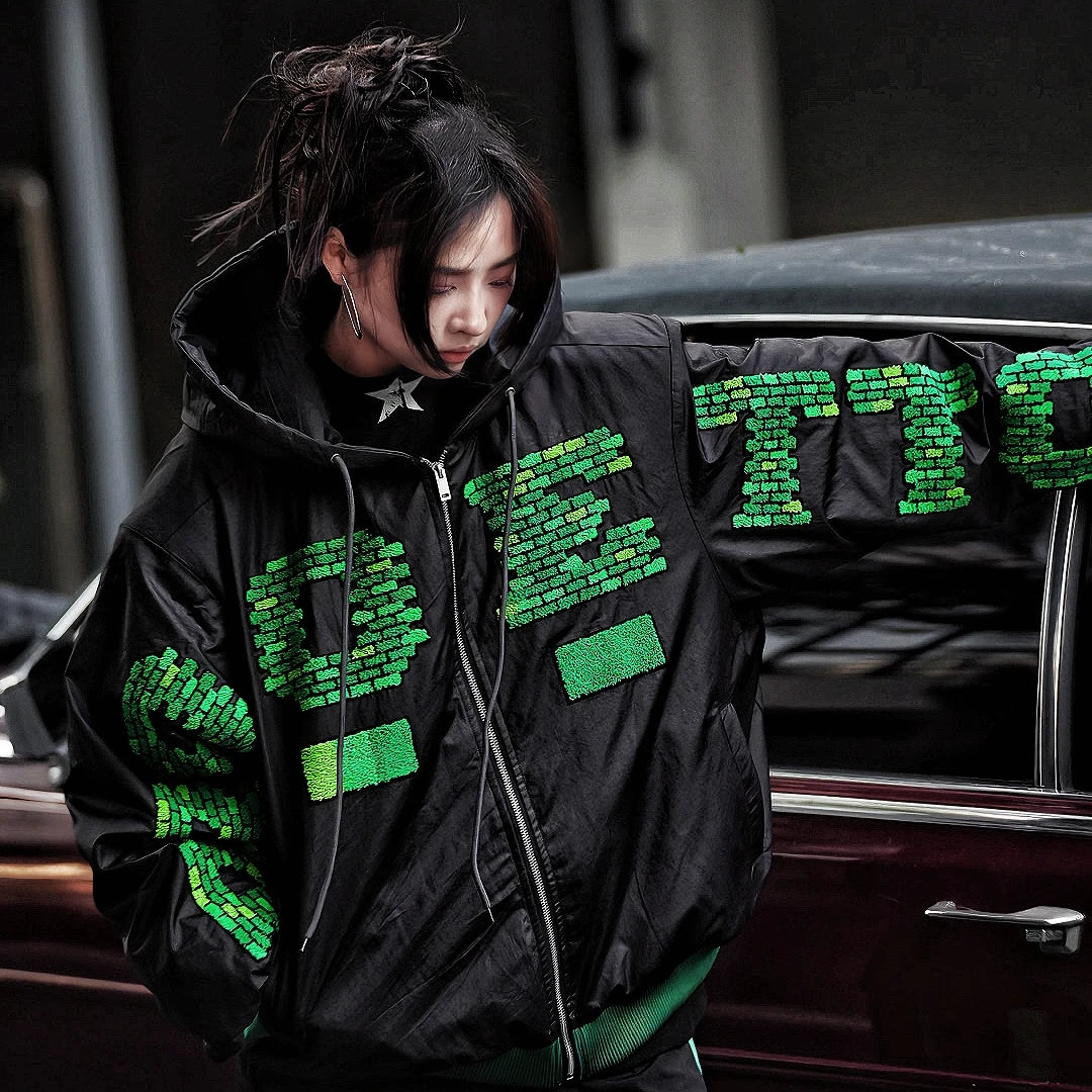 Sanhoostudio heavyweight hooded jacket features handcrafted patchwork details, a relaxed oversized fit, and a double-breasted front. Designed for winter warmth with bold street attitude.