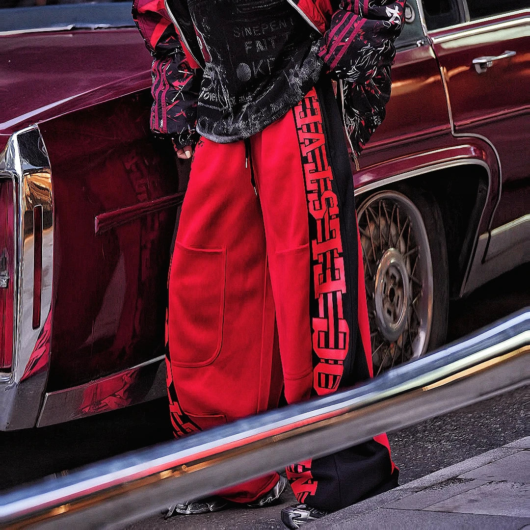 Sanhoostudio fleece-lined wide-leg pants made from cotton-poly blend. Designed with vintage stripe print, high-waist cut, and oversized silhouette for warmth and effortless street versatility.