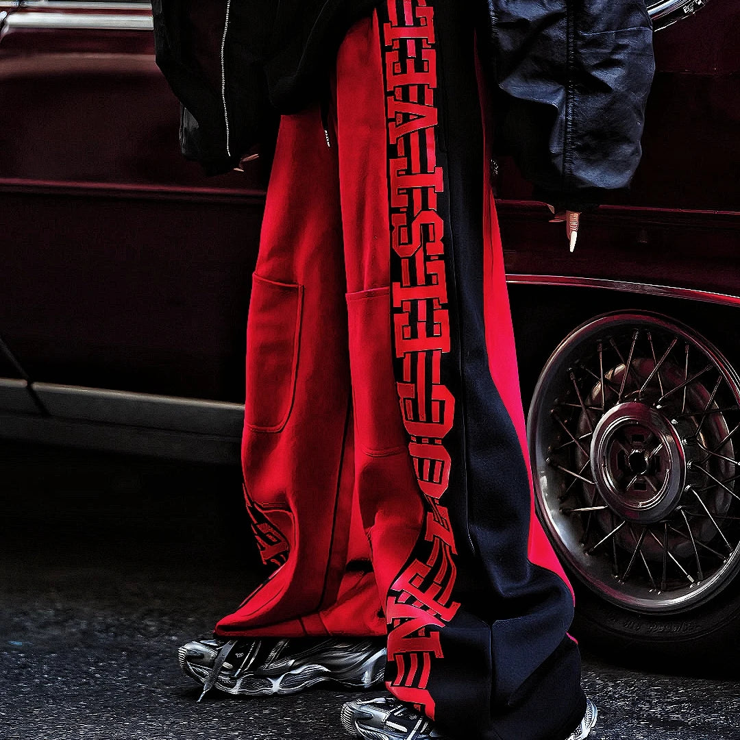 Sanhoostudio fleece-lined wide-leg pants made from cotton-poly blend. Designed with vintage stripe print, high-waist cut, and oversized silhouette for warmth and effortless street versatility.