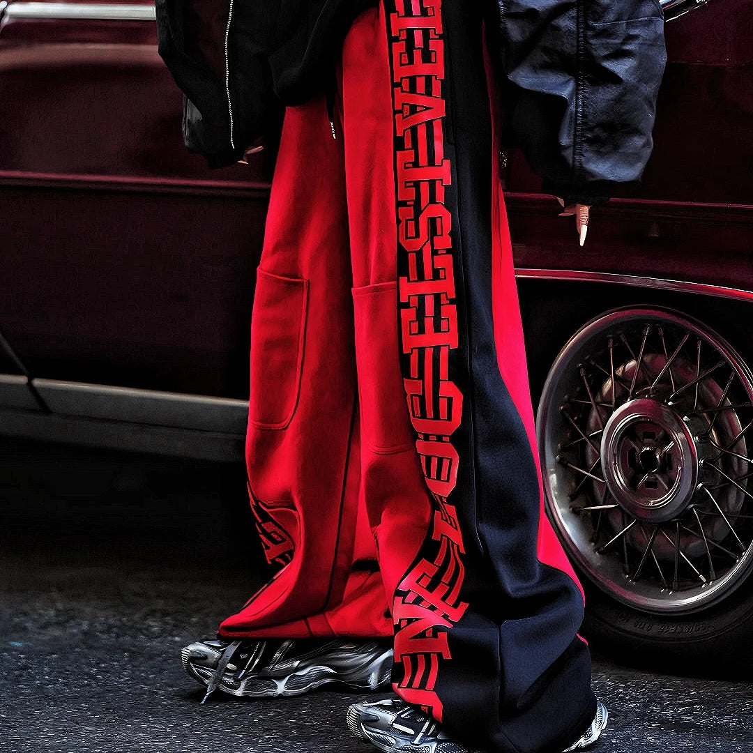 Sanhoostudio fleece-lined wide-leg pants made from cotton-poly blend. Designed with vintage stripe print, high-waist cut, and oversized silhouette for warmth and effortless street versatility.