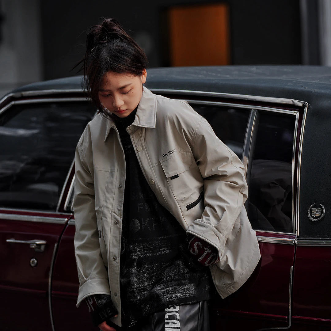 Sanhoostudio washed denim varsity jacket featuring contrast paneling and relaxed fit. A timeless unisex jacket for everyday streetwear layering.