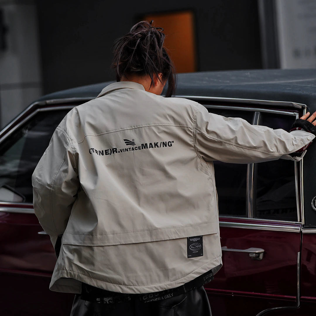 Sanhoostudio washed denim varsity jacket featuring contrast paneling and relaxed fit. A timeless unisex jacket for everyday streetwear layering.