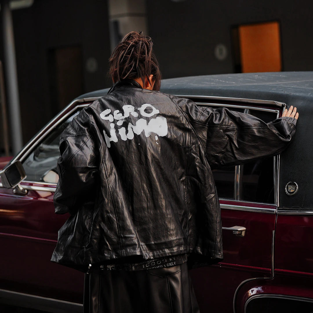 Sanhoostudio washed denim varsity jacket featuring contrast paneling and relaxed fit. A timeless unisex jacket for everyday streetwear layering.