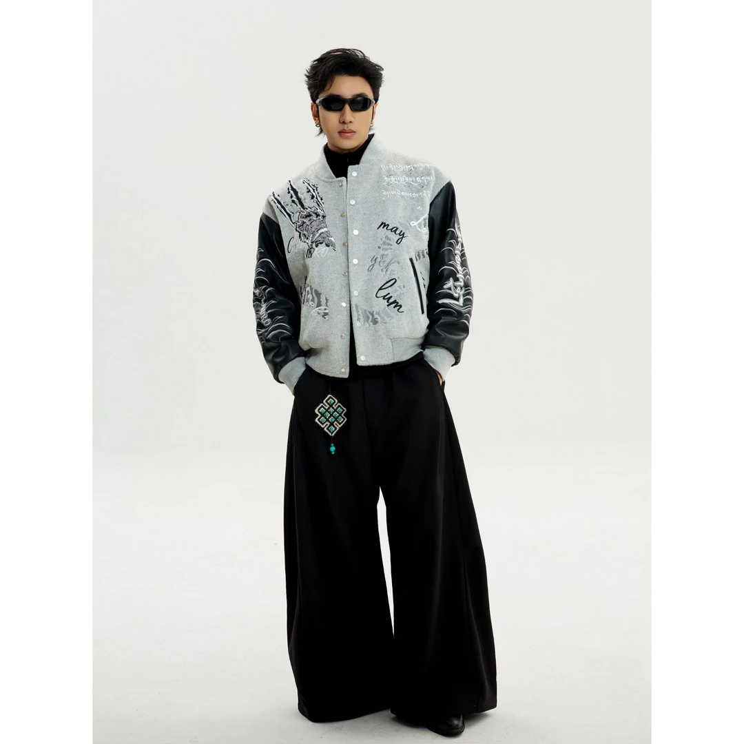 Sanhoostudio heavyweight varsity jacket featuring embroidered details and high street design. A bold unisex streetwear outerwear piece built for modern urban styling.