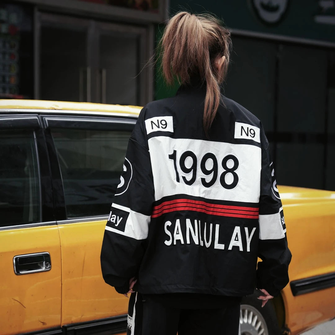Sanhoostudio varsity jacket featuring heavy embroidery and biker-inspired design for bold streetwear outfits.