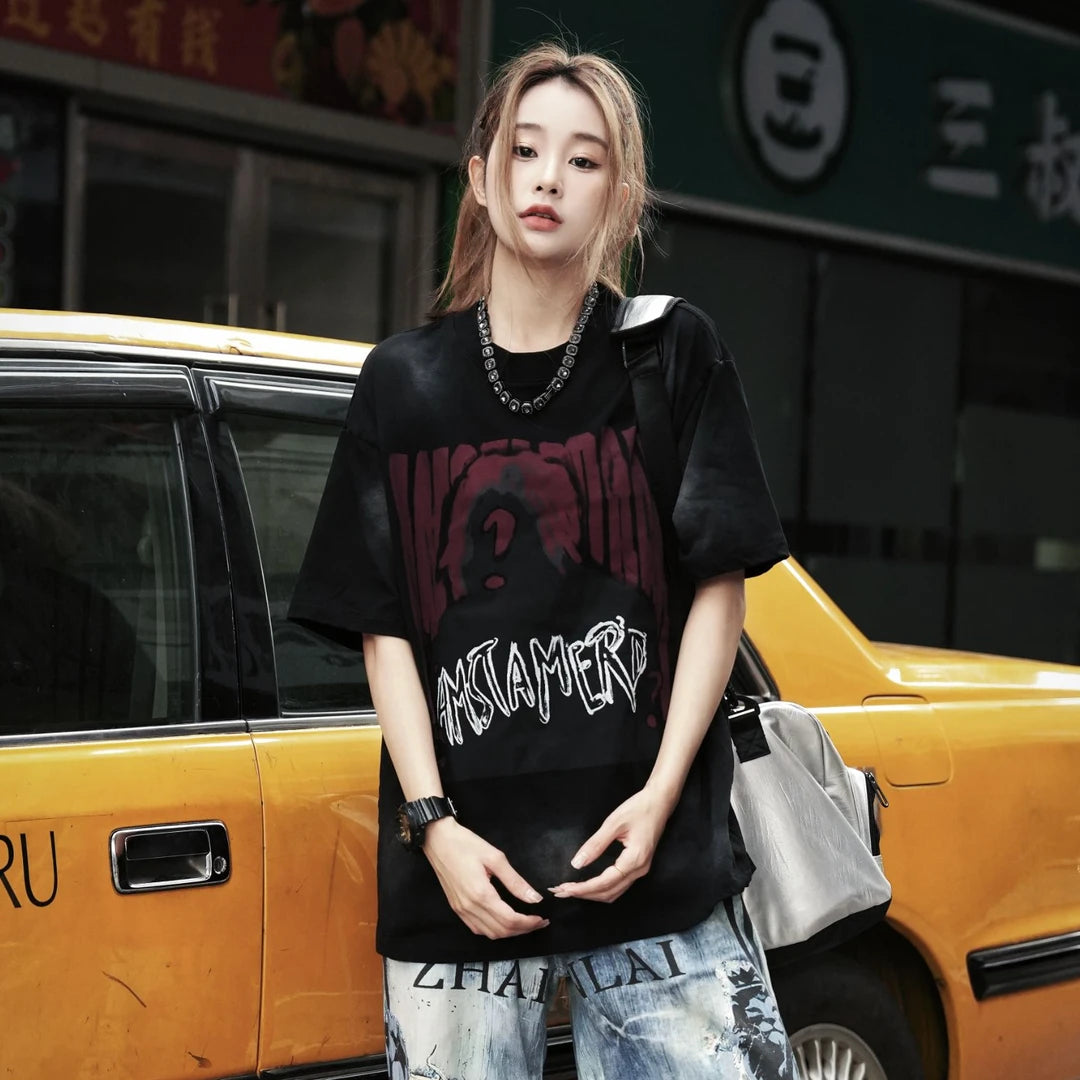 Sanhoostudio oversized T-shirt featuring distressed finish, printed design, and relaxed fit for bold streetwear styling.