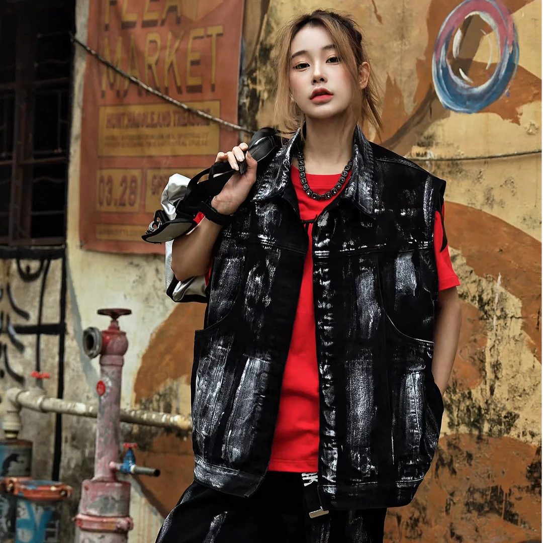 Sanhoostudio denim vest featuring sleeveless design, padded shoulders, and structured silhouette for bold streetwear layering.
