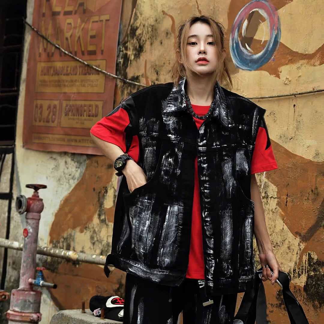 Sanhoostudio denim vest featuring sleeveless design, padded shoulders, and structured silhouette for bold streetwear layering.