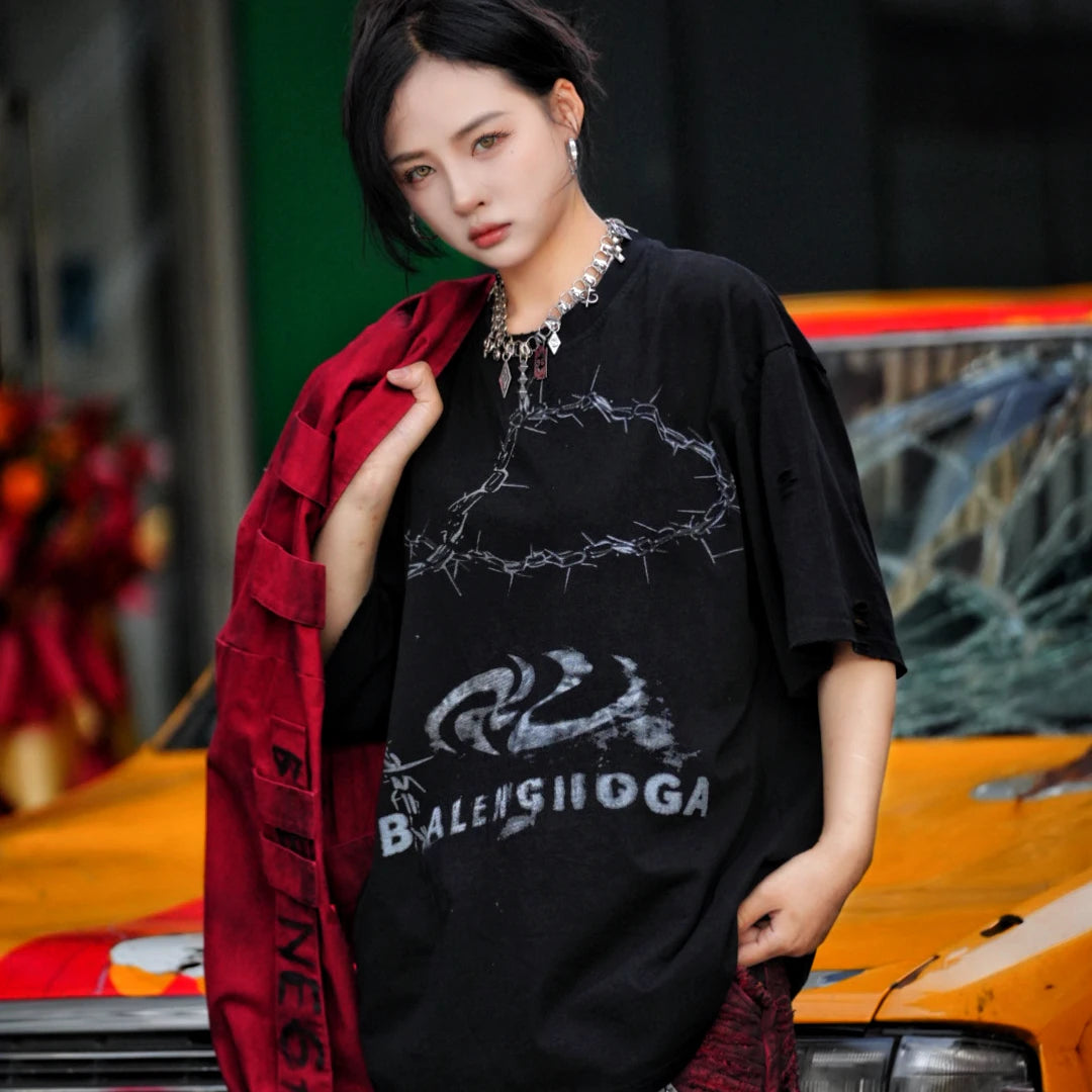 Sanhoostudio short sleeve T-shirt featuring patchwork construction and graphic print design with a relaxed fit silhouette. Designed for modern streetwear styling with comfort, versatility, and everyday wear appeal.