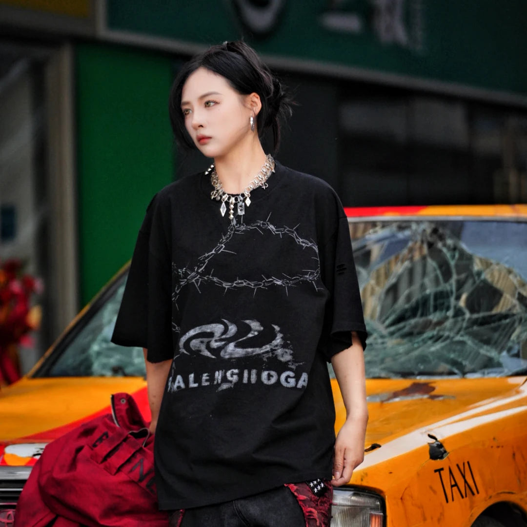 Sanhoostudio short sleeve T-shirt featuring patchwork construction and graphic print design with a relaxed fit silhouette. Designed for modern streetwear styling with comfort, versatility, and everyday wear appeal.