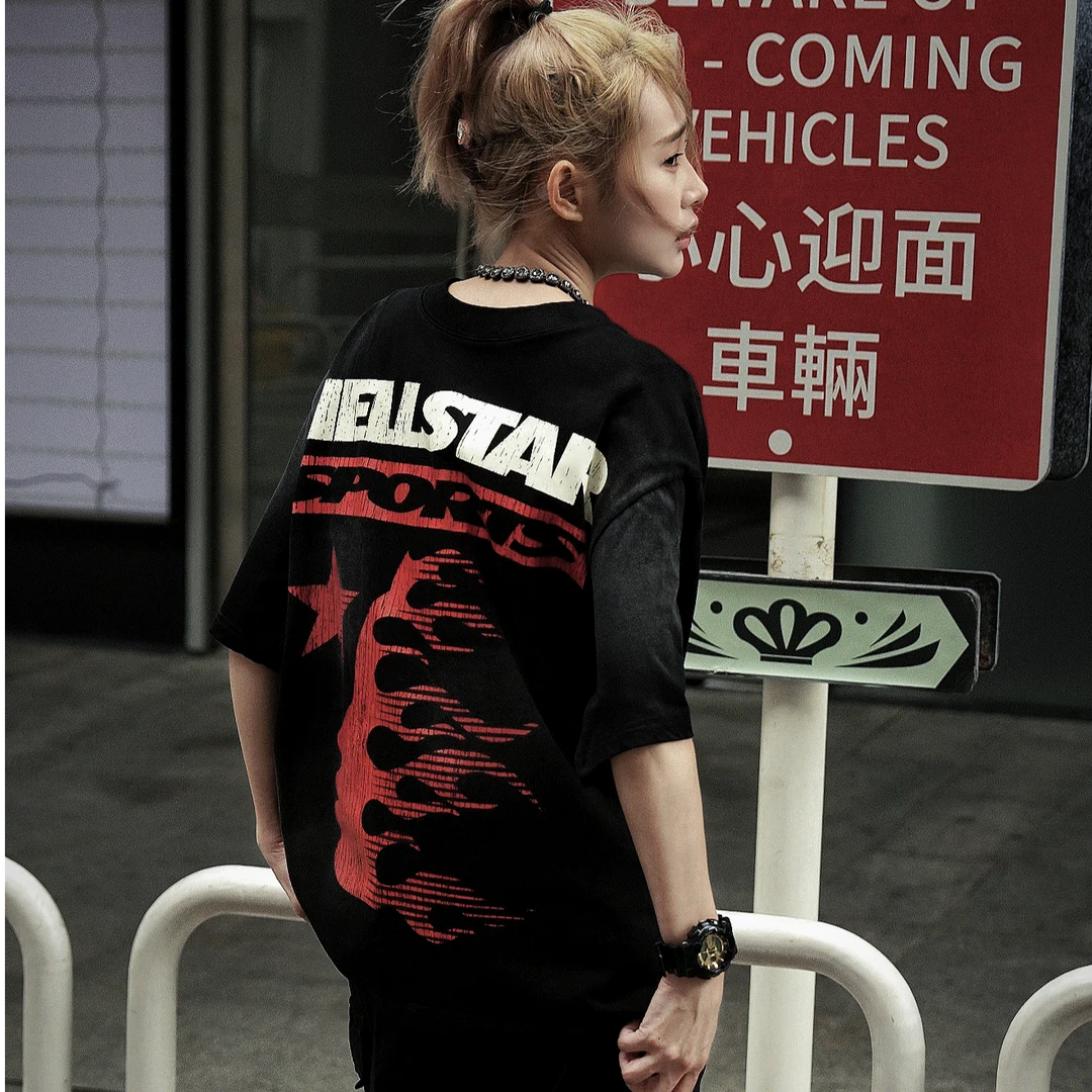 Sanhoostudio oversized short sleeve T-shirt featuring bold graphic print, breathable fabric, and relaxed fit silhouette. Designed for modern streetwear outfits, daily casual wear, and easy layering across seasons.