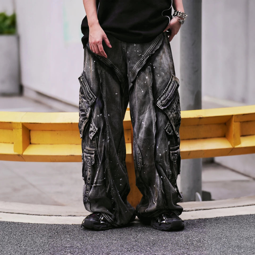 Sanhoostudio wide leg cargo pants featuring distressed wash, paint splatter details, and multi-pocket design. Built for functional streetwear styling with durability, comfort, and bold urban aesthetics.