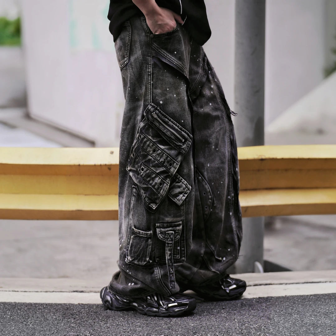 Sanhoostudio wide leg cargo pants featuring distressed wash, paint splatter details, and multi-pocket design. Built for functional streetwear styling with durability, comfort, and bold urban aesthetics.