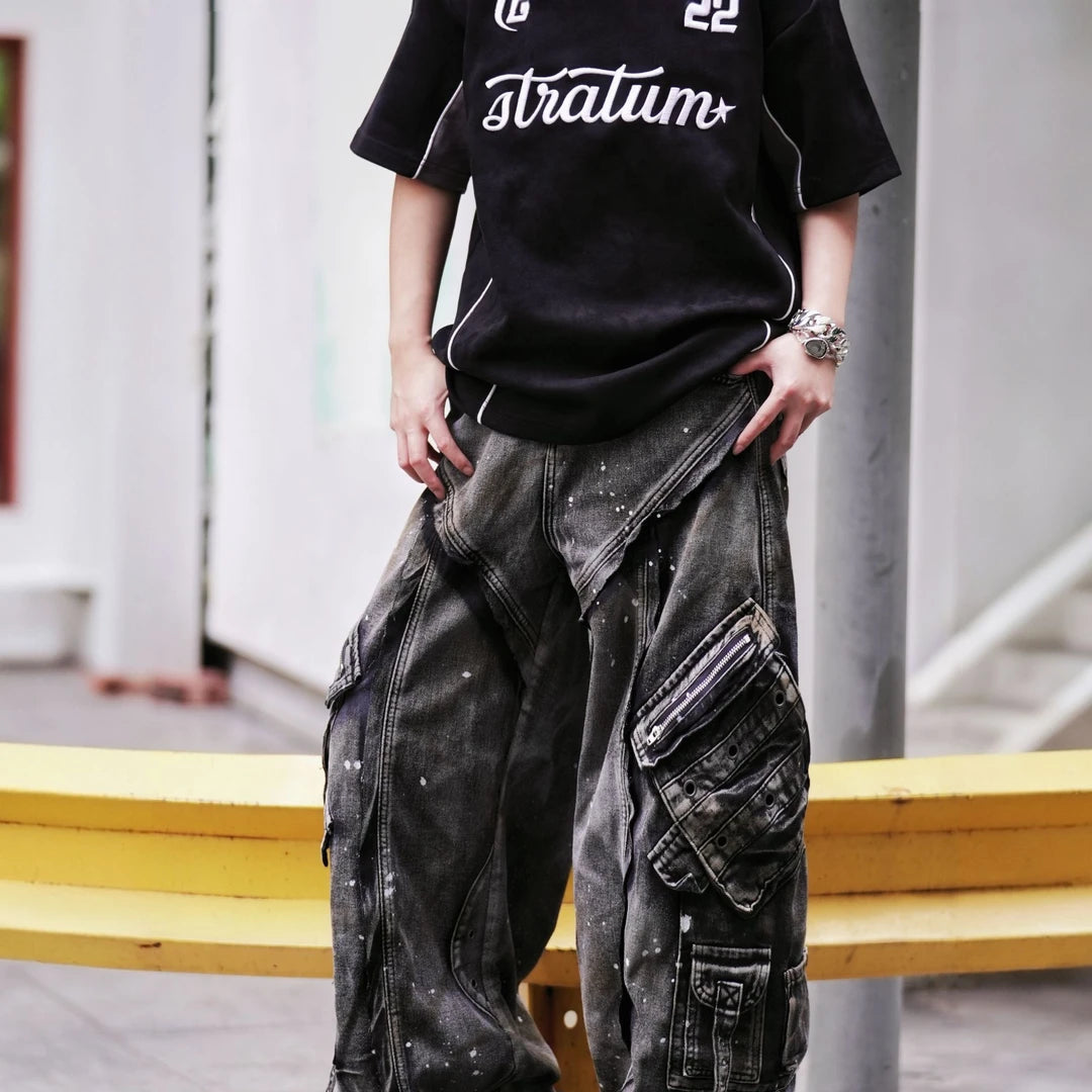 Sanhoostudio wide leg cargo pants featuring distressed wash, paint splatter details, and multi-pocket design. Built for functional streetwear styling with durability, comfort, and bold urban aesthetics.