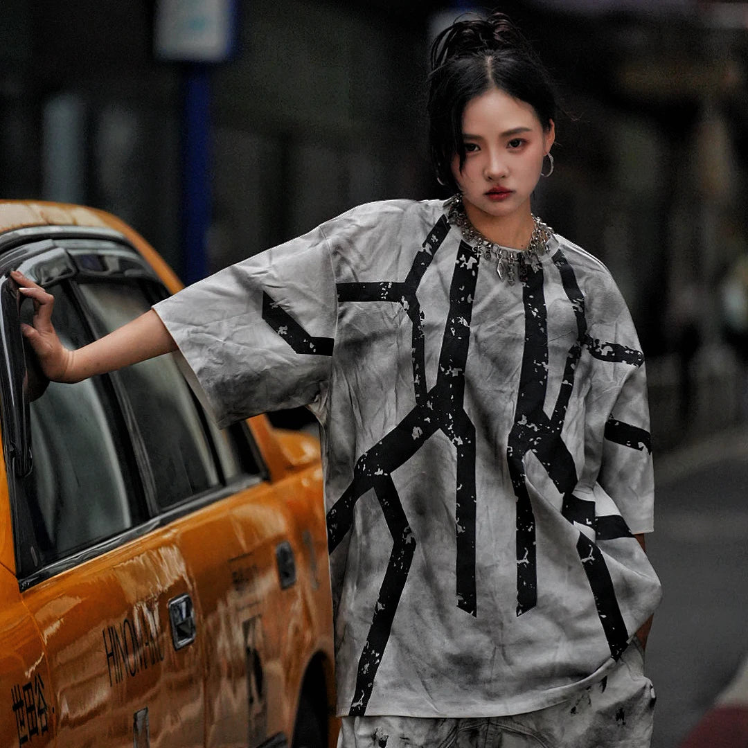 Sanhoostudio short sleeve T-shirt featuring tie dye finish, graphic print design, and relaxed fit silhouette. Designed for modern streetwear outfits with breathable comfort, bold visual appeal, and versatile everyday wear.