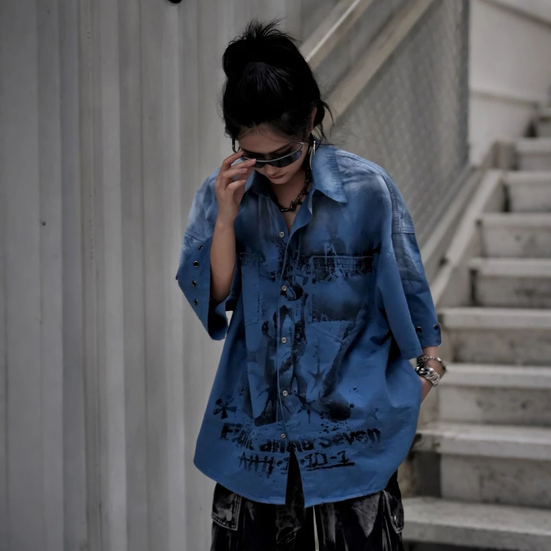 Sanhoostudio short sleeve shirt featuring graffiti print, distressed finish, and relaxed fit silhouette. Designed for modern streetwear styling with breathable fabric and versatile everyday wear.