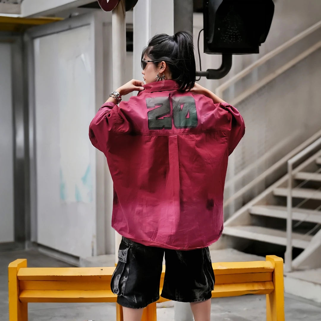 Sanhoostudio short sleeve shirt featuring military-inspired graphics, distressed dye finish, and relaxed silhouette. Designed for streetwear styling with breathable fabric and versatile daily wear.