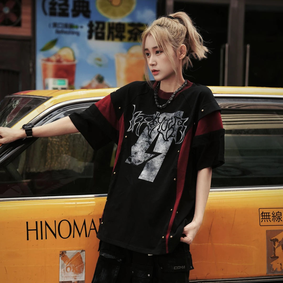 Sanhoostudio short sleeve T-shirt featuring studded details, colorblock design, and relaxed fit silhouette. A bold streetwear piece designed for standout looks with comfort and everyday wearability.