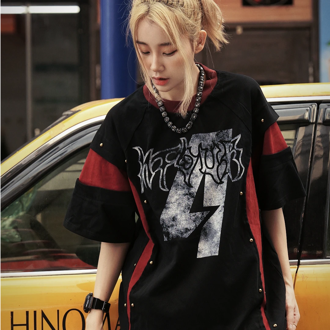 Sanhoostudio short sleeve T-shirt featuring studded details, colorblock design, and relaxed fit silhouette. A bold streetwear piece designed for standout looks with comfort and everyday wearability.