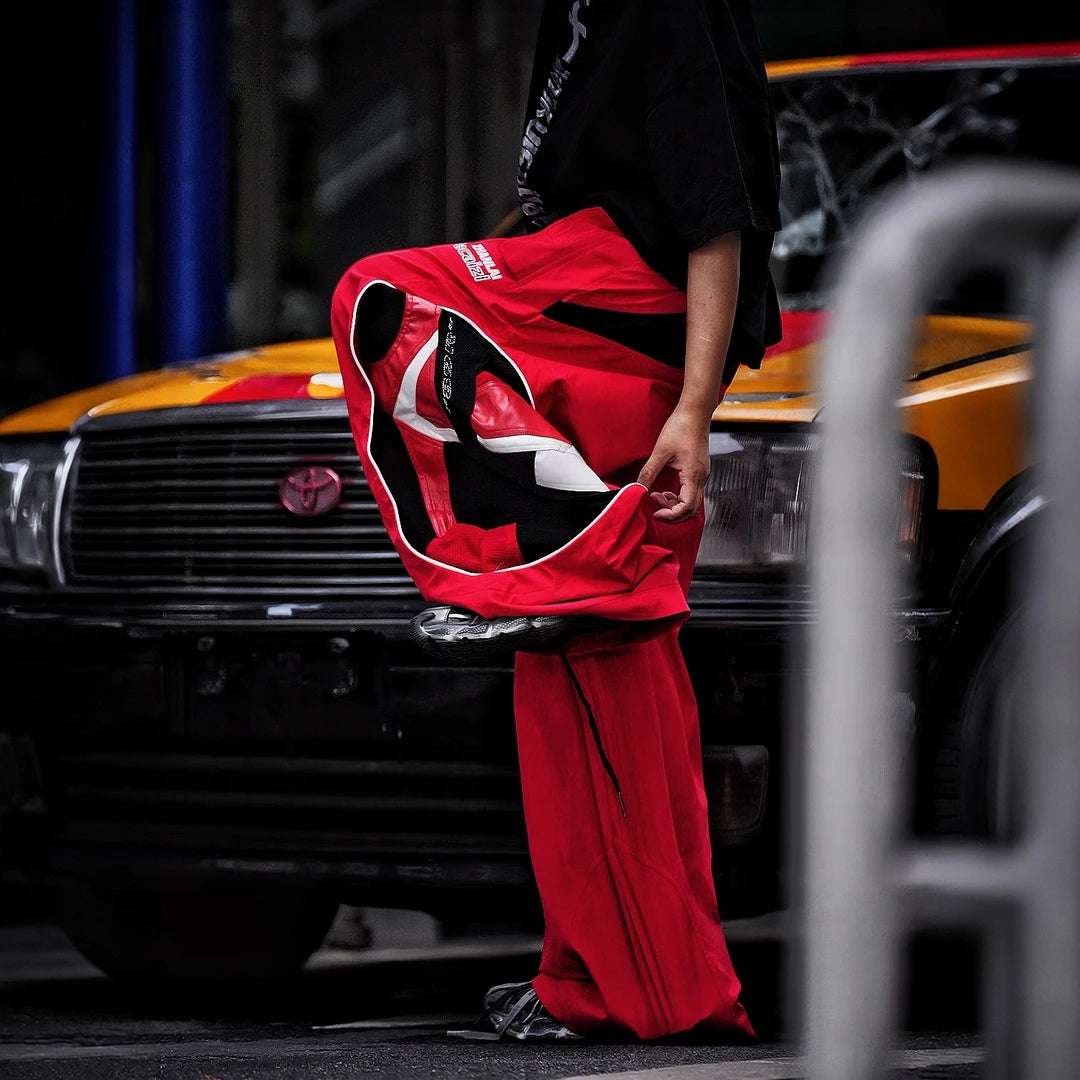 Sanhoostudio denim pants featuring graffiti artwork, patchwork construction, and distressed finish. Built for bold streetwear outfits with wide leg fit, durability, and standout visual styling.