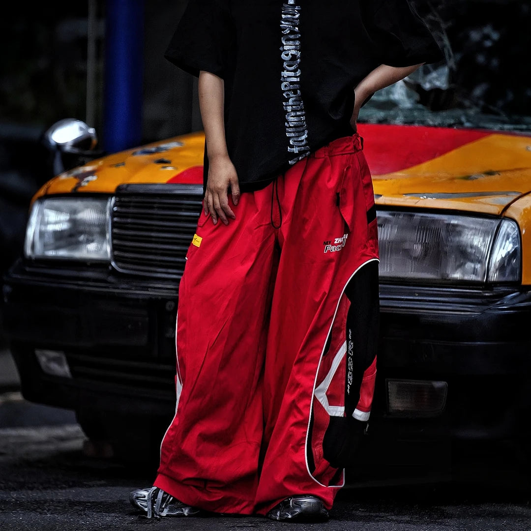 Sanhoostudio denim pants featuring graffiti artwork, patchwork construction, and distressed finish. Built for bold streetwear outfits with wide leg fit, durability, and standout visual styling.