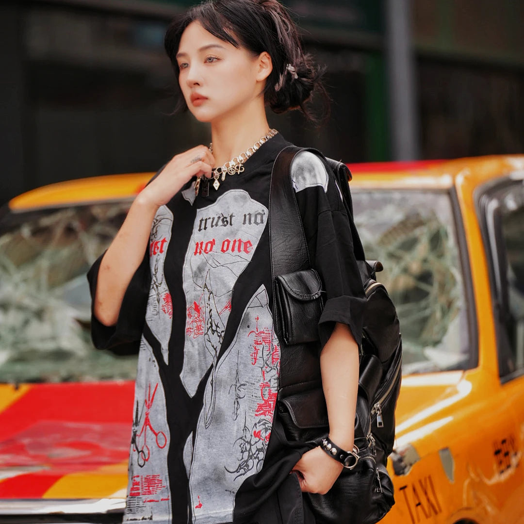 Sanhoostudio short sleeve T-shirt featuring patchwork construction, graphic print design, and oversized fit silhouette. Built for modern streetwear outfits with breathable comfort and everyday versatility.