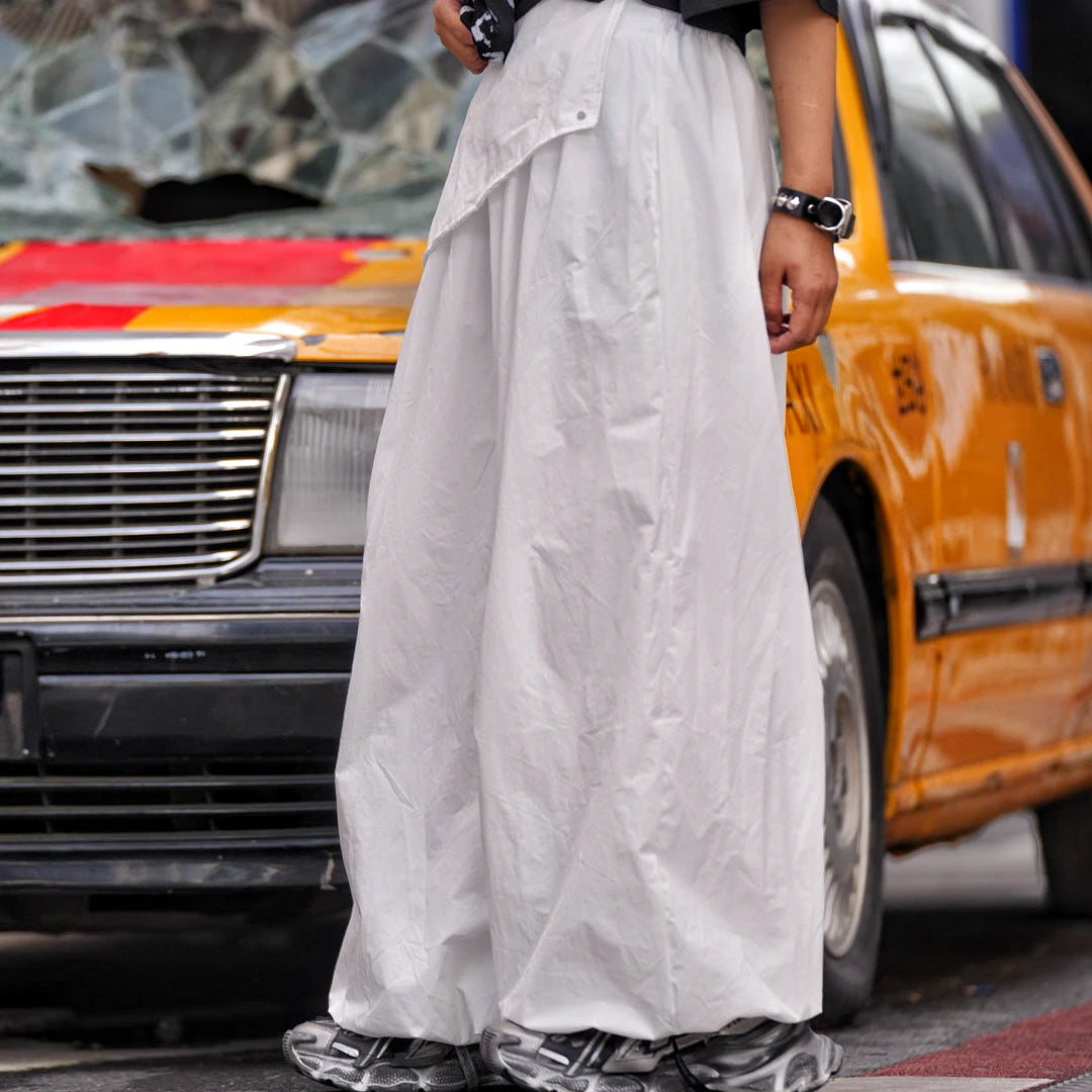 Sanhoostudio wide leg pants featuring washed finish and scythe-cut silhouette with a relaxed fit design. Built for comfortable streetwear styling with lightweight feel and versatile everyday wear.