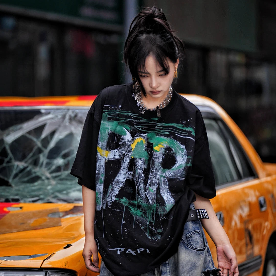 Sanhoostudio short sleeve T-shirt featuring graffiti spray print design and oversized fit silhouette. Designed for modern streetwear styling with breathable comfort, lightweight feel, and versatile everyday summer wear.