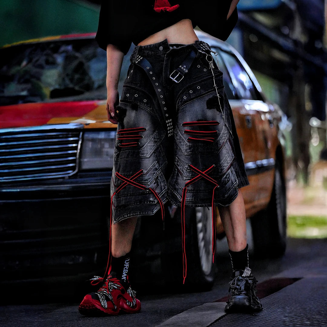 Sanhoostudio denim shorts featuring distressed wash treatment, patchwork construction, and an irregular loose-fit silhouette. Designed for summer streetwear styling with breathable comfort and standout urban appeal.